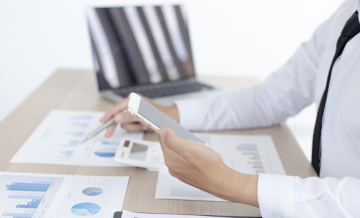 Businessman Looking at Charts 